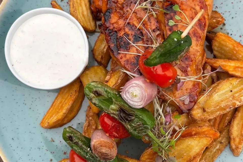 Honey-Garlic Chicken Breast, served with steak potatoes, vegetable skewer, and garlic dipping sauce (L,T)